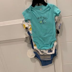 Four brand new boys onsies.